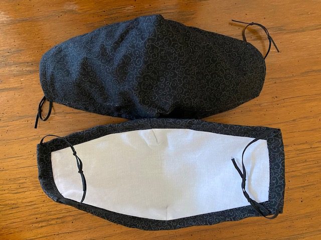 Black cloth mask, with white interior